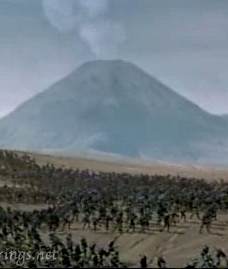 Thousands of orcs march through Mordor, with Mt. Doom smoking in the background.