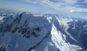 Mount Cook and a whole lot of other snowy mountains behind it.